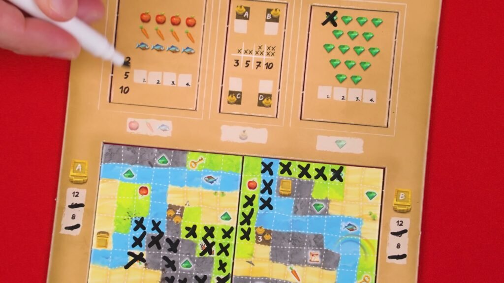 Hand marking a Ravensburger's Explorers game board with various icons and tokens.