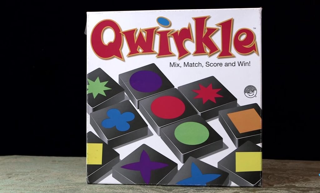 Qwirkle board game box featuring colorful shapes and the game's logo.