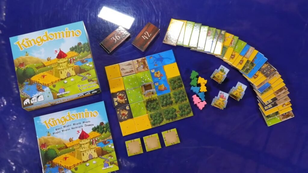 Kingdomino board game components laid out on a table.