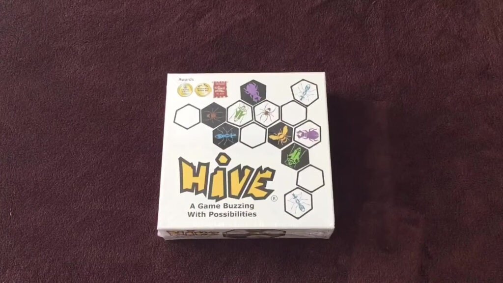 Hive game box on a brown surface.