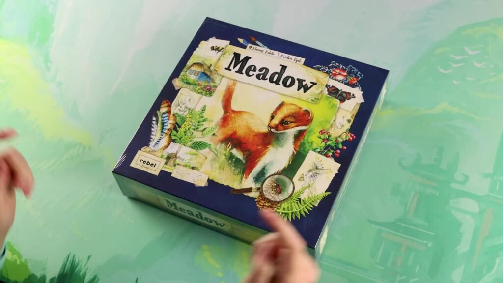 Meadow board game box featuring a squirrel and nature elements